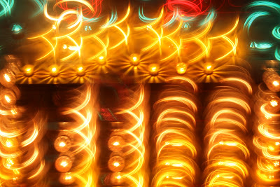 Yellow squiggly lights captured at night with Bulb shutter setting