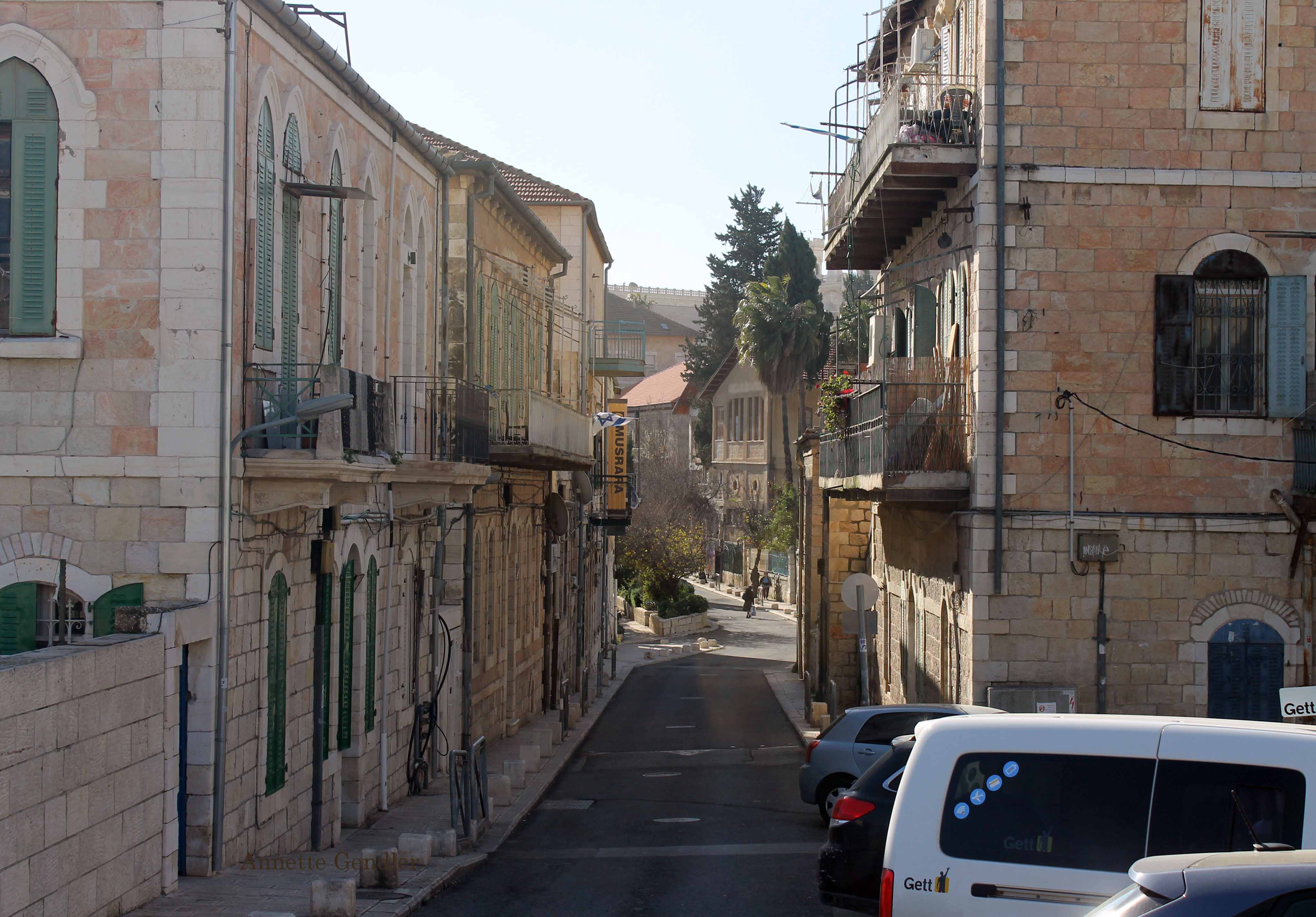 View of HaAyin Street in Jerusalem, beautiful old two- and three-story limestone buildings on both sides