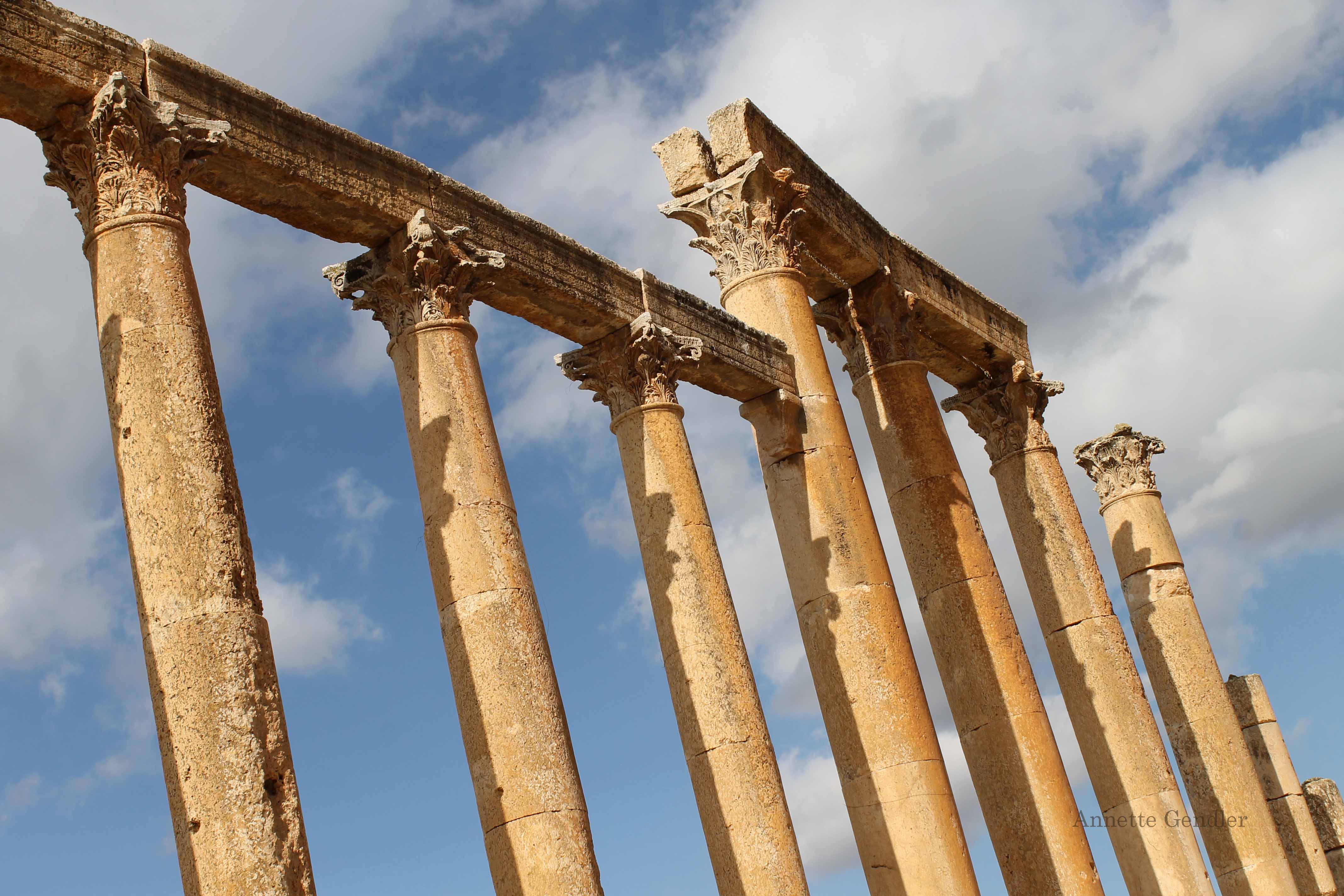 Roman columns against a blue sky