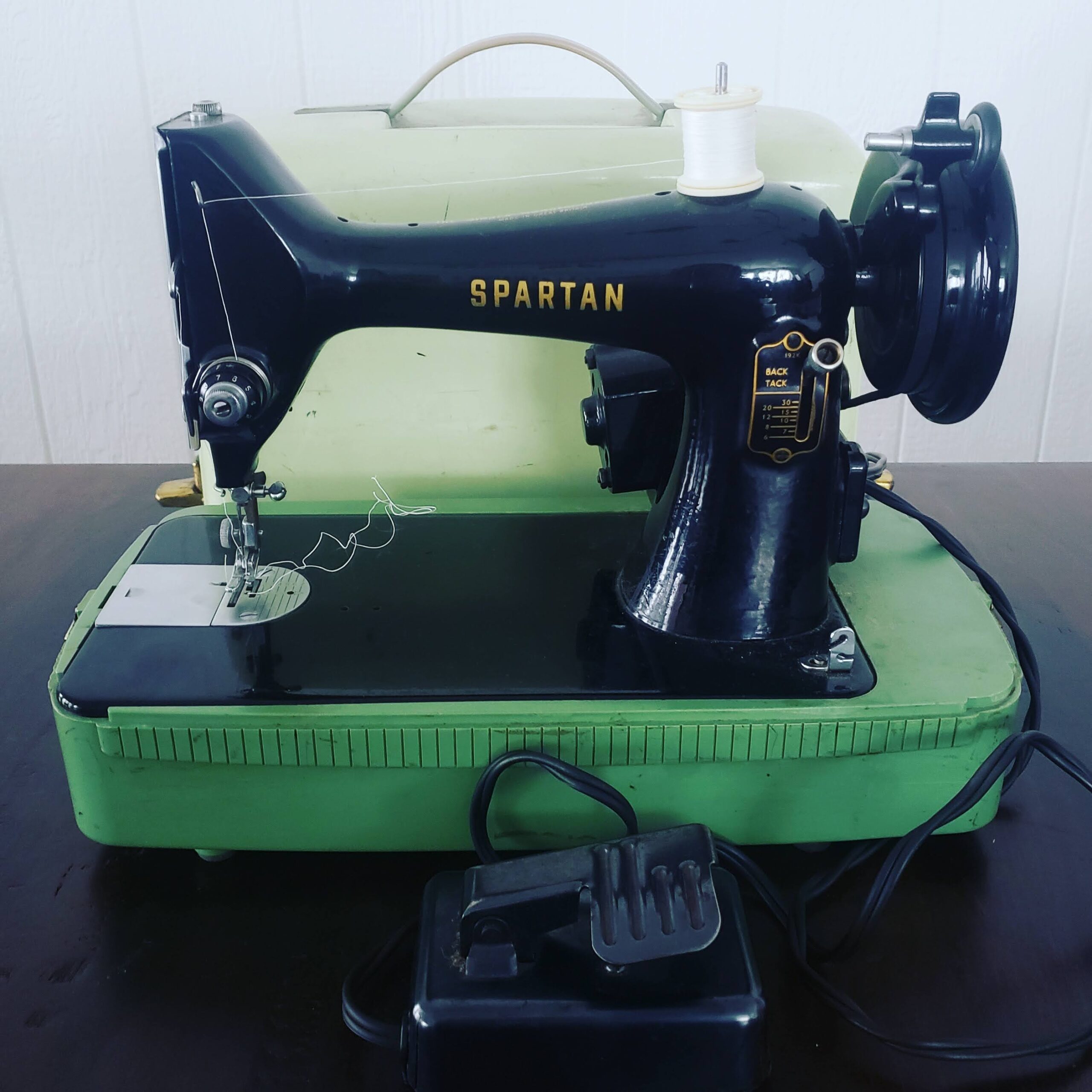 Singer Spartan Sewing Machine with mint green base and carrying case