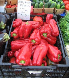red peppers in a supermarket bin