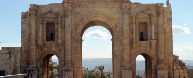 Hadrian's Arch in Jerash, Jordan against a blue sky