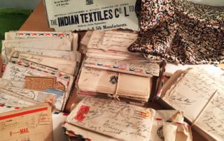 pile of letters with handwriting addresses sent from India to the U.S during WWII
