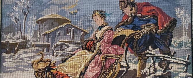 tapestry showing a winter scene of a man pushing a woman on a sleigh